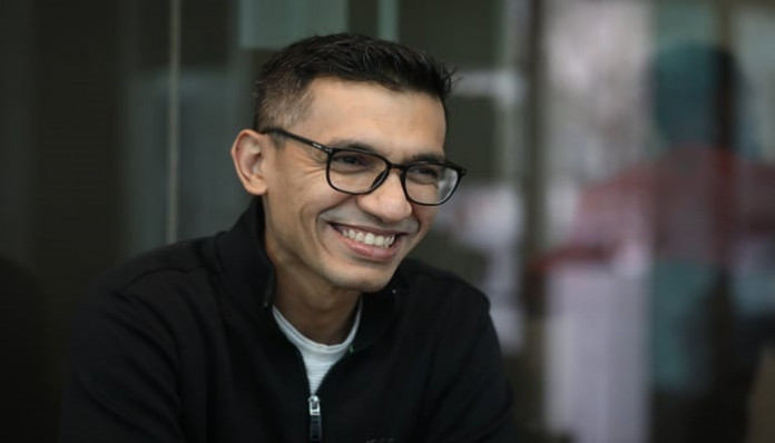 Ashik Chowdhury smiles to the camera