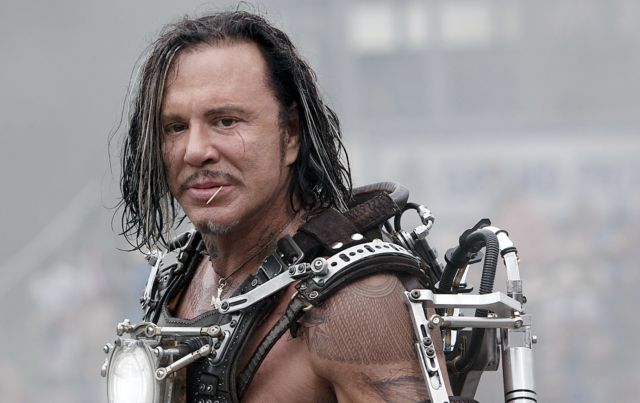 Mickey Rourke poses for pictures
