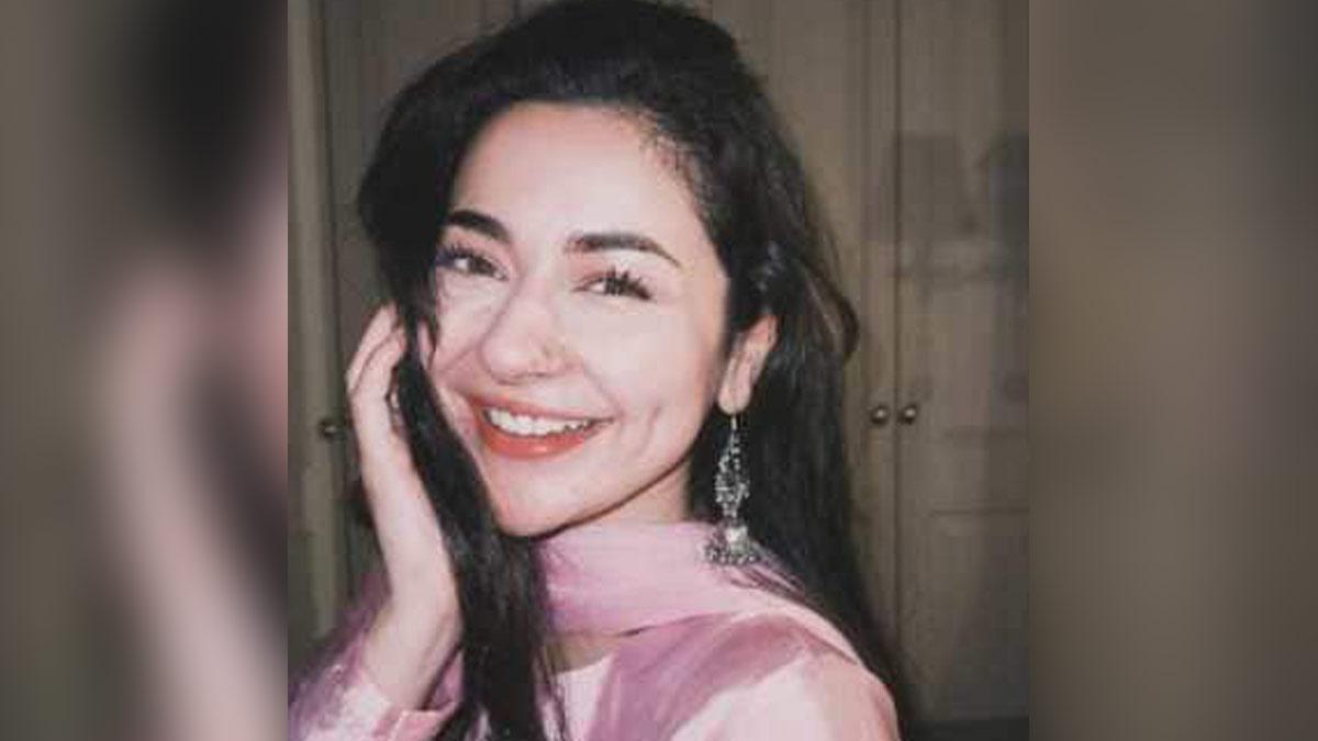 Hania Amir smiles to the camer
